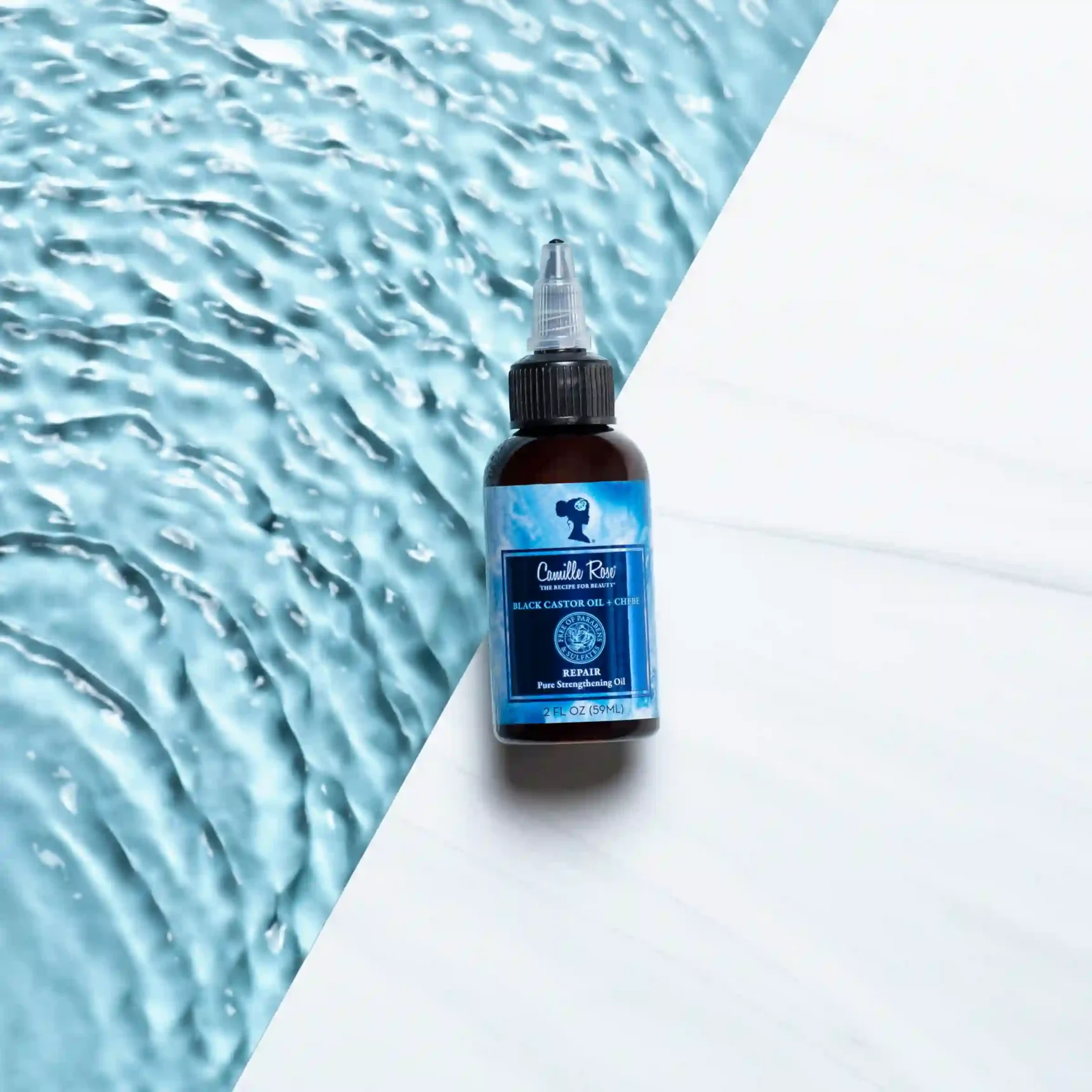 Black Castor Oil + Chebe Repair Camille Rose for hair growth, shine, and strand strengthening.