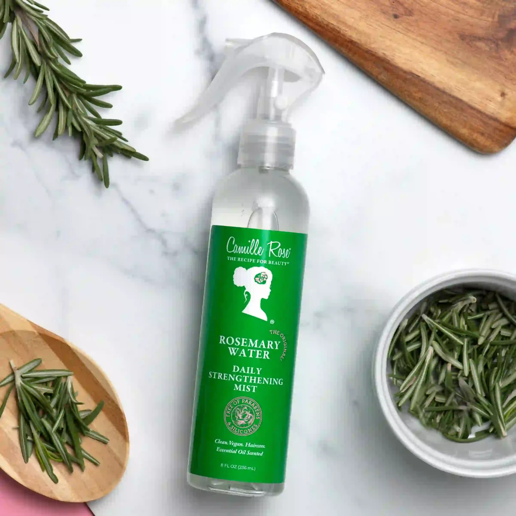 Rosemary Water Daily Strengthening Mist Camille Rose with biotin, peppermint, and amla to stimulate follicles, reduce scalp inflammation, and strengthen hair.
